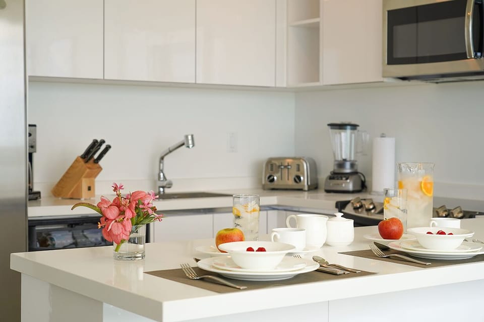 Step into your bright, modern kitchen, fully equipped for leisurely breakfasts with sleek appliances, ample counter space, and everything you need to feel at home.