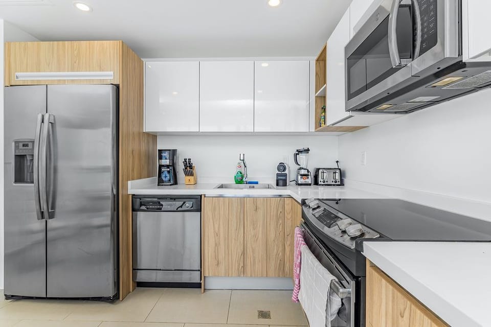 Your modern kitchen has everything you need: full-size appliances, ample counter space, and quality cookware. Prepare meals with ease, whether it's morning coffee or a full dinner.