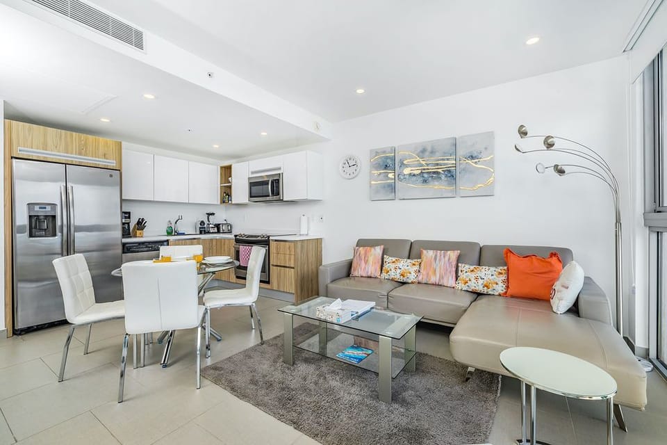 Your bright, open living space seamlessly blends kitchen and lounge, inviting you to cook, dine, and relax in modern comfort with stylish touches throughout.