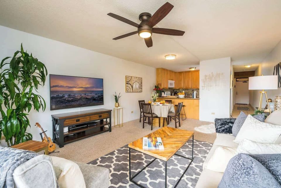 Unwind in our stylish living room with garden views, modern decor, and all the comforts of home.