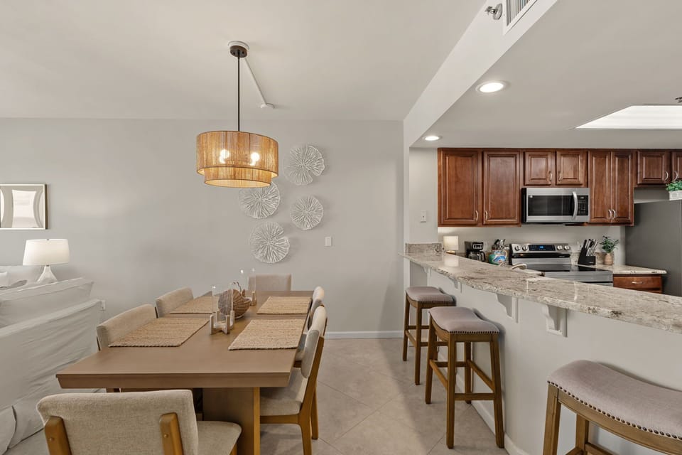 You'll love cooking and dining in this open-concept space with granite counters, modern appliances, and stylish seating for memorable meals together.