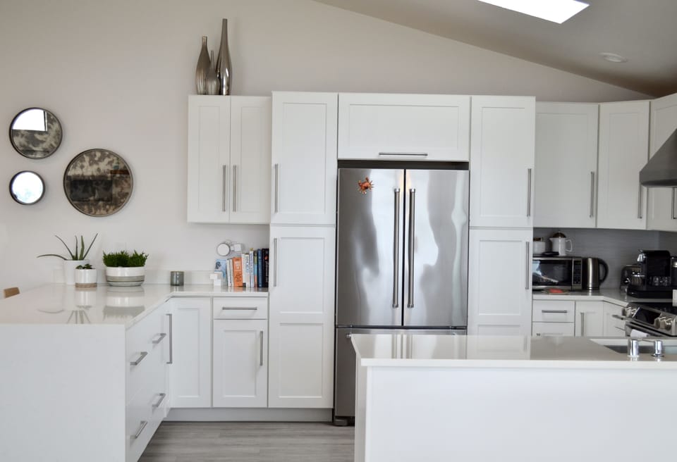 View from the dining room of fully stocked open concept kitchen