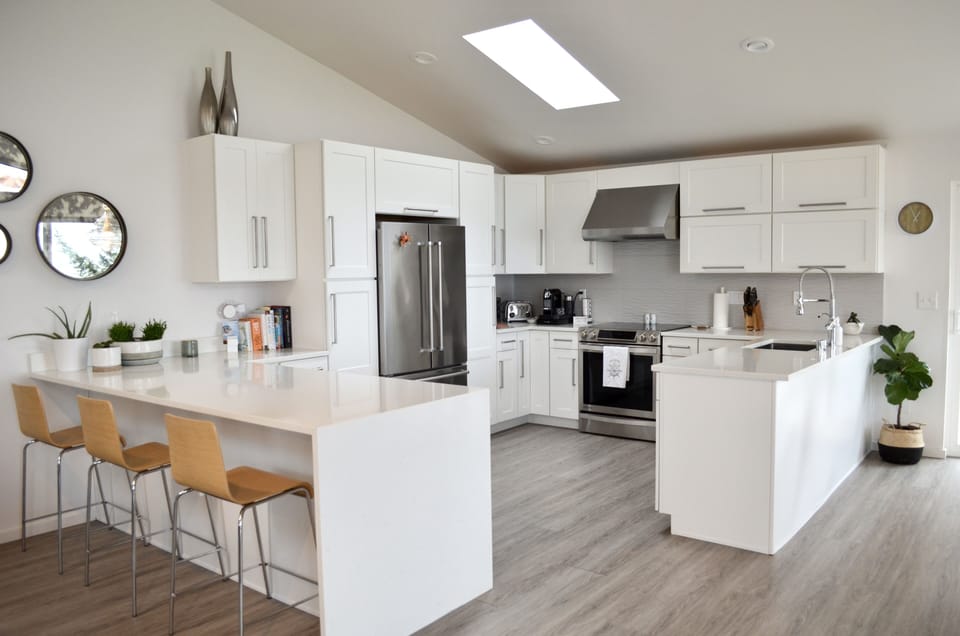 Bar seating in open concept kitchen with views of the Salish Sea