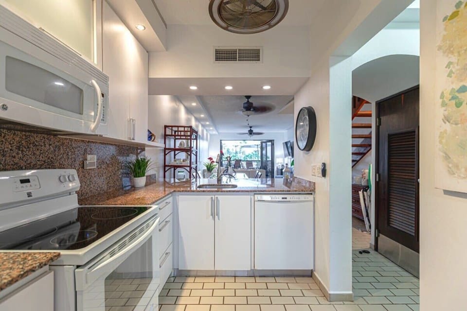 Kitchen is along side the dining and living area