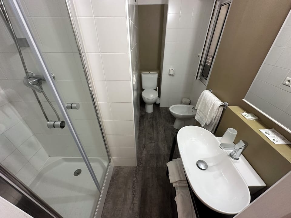 Classic Twin Room | Bathroom | Shower, hair dryer, bathrobes, towels