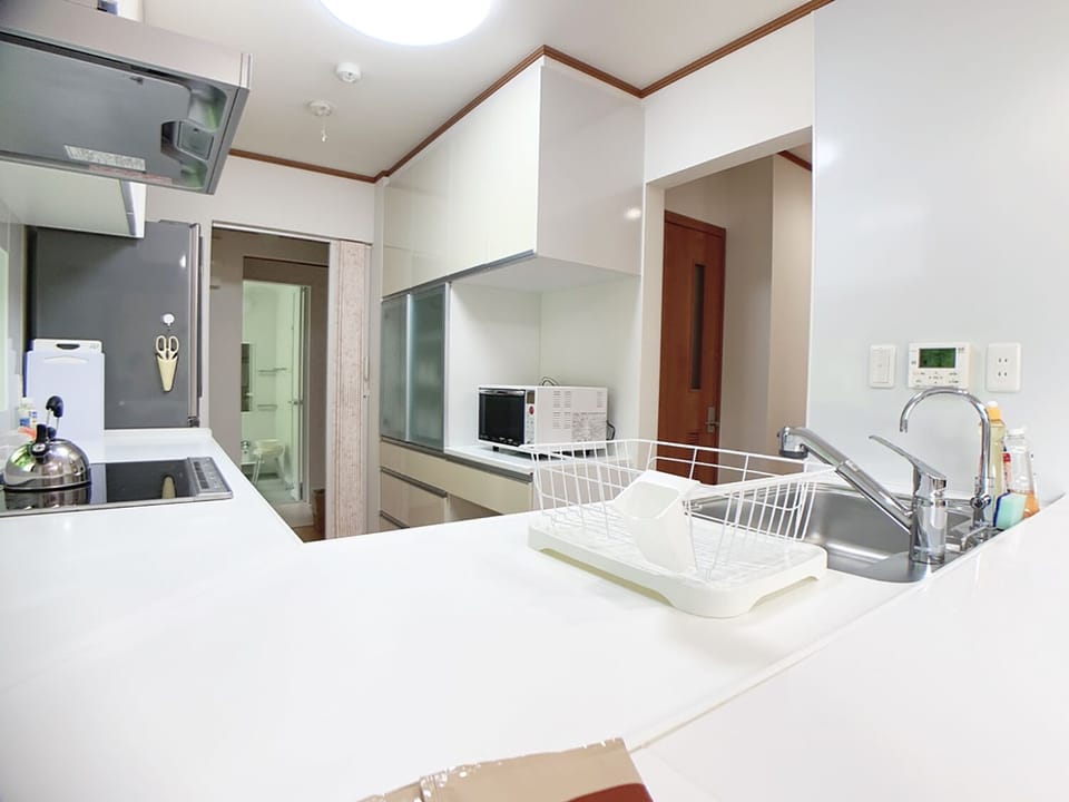 3 Bedroom 2 Story House with Balcony, Non Smoking | Private kitchenette | Coffee/tea maker, fridge, microwave, cookware/dishes/utensils
