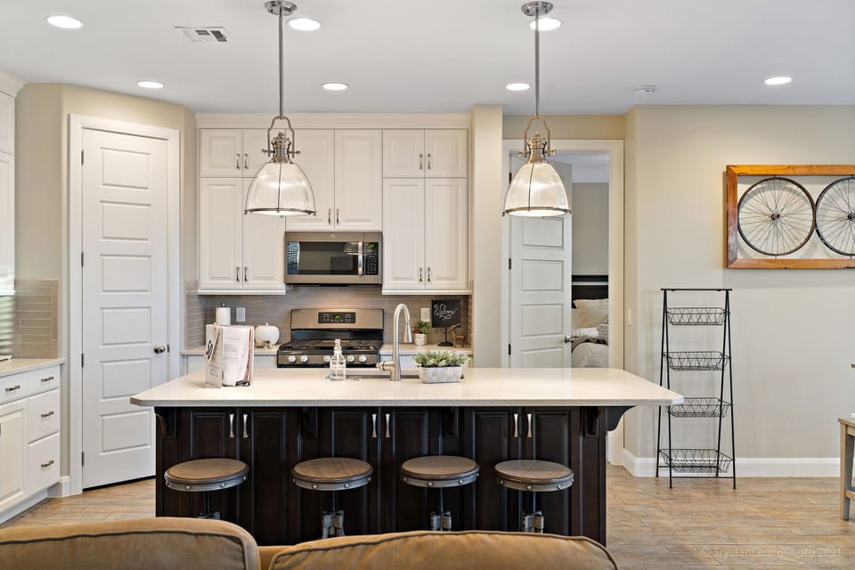 Fully stocked gourmet kitchen featuring all the comforts of home and extra seating at the bar