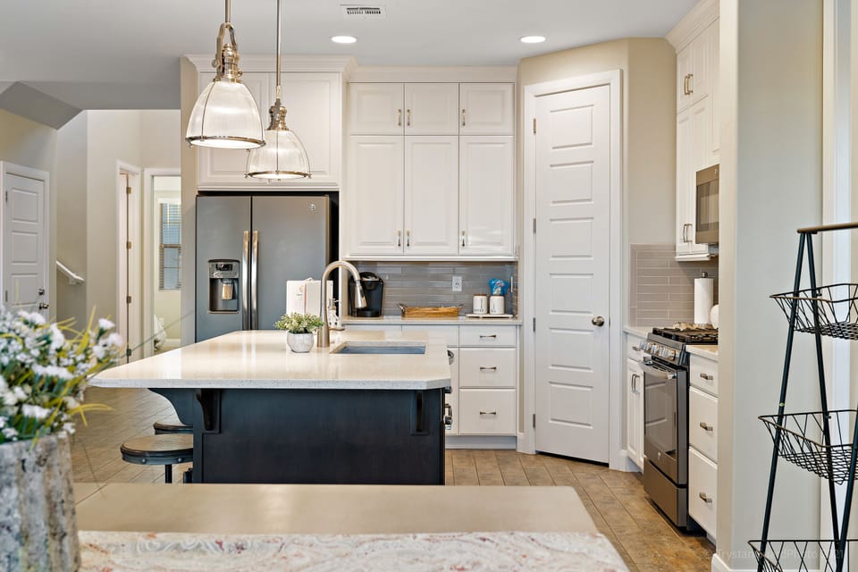 Fully stocked gourmet kitchen featuring all the comforts of home and extra seating at the bar