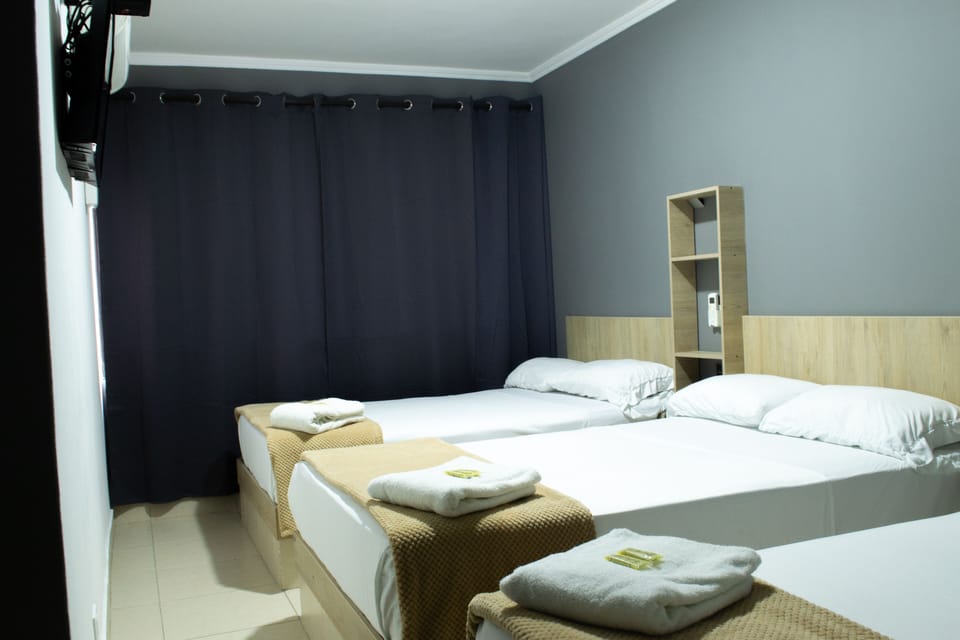 Standard Triple Room | Minibar, desk, laptop workspace, soundproofing