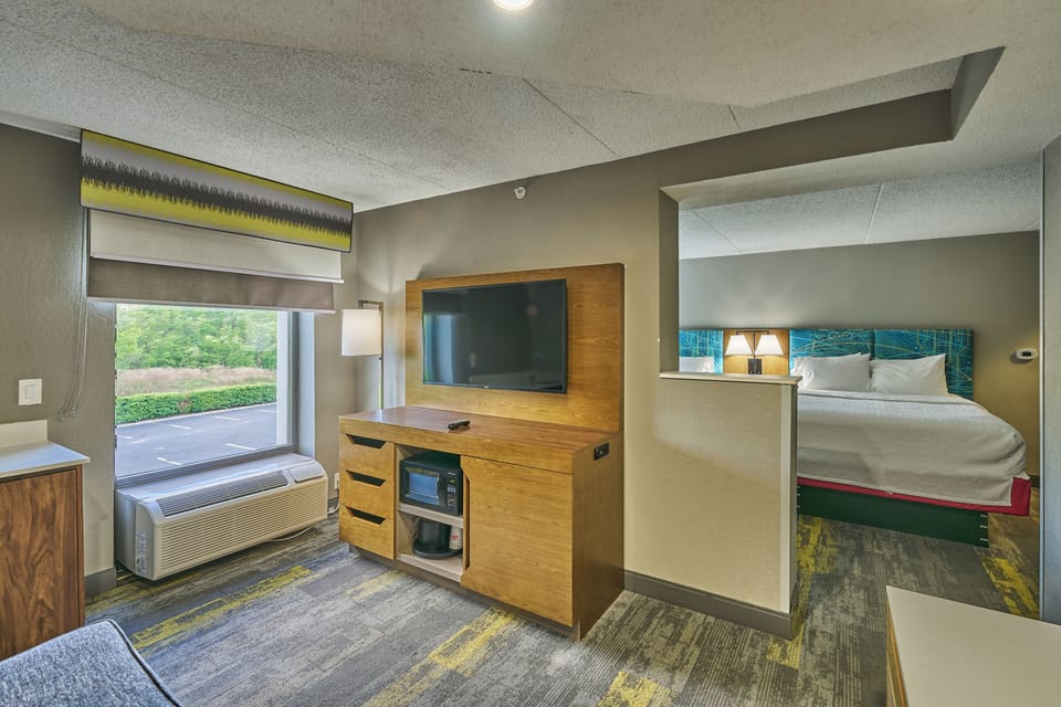 Suite, 2 Queen Beds, Non Smoking | Iron/ironing board, free cribs/infant beds, free WiFi, bed sheets