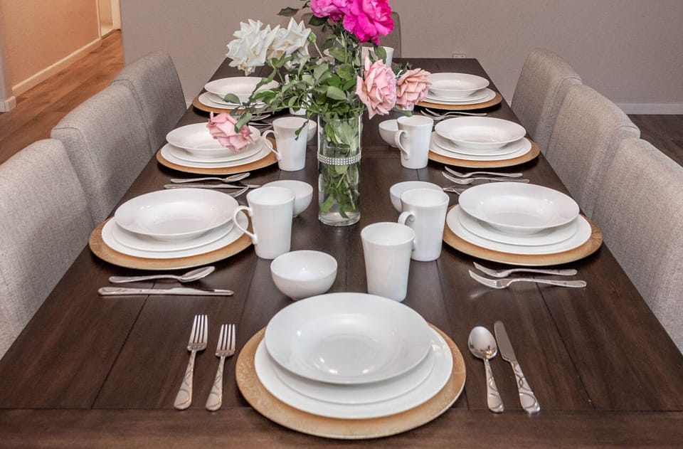 Dining table, dinnerware set, silverware set