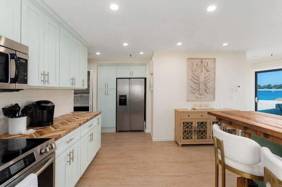 Full size kitchen with everything you need to cook and dine with. (Something none of the hotels around here have!) 
