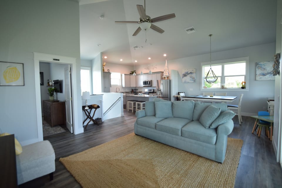 Open floor plan family room, dining, kitchen with center island