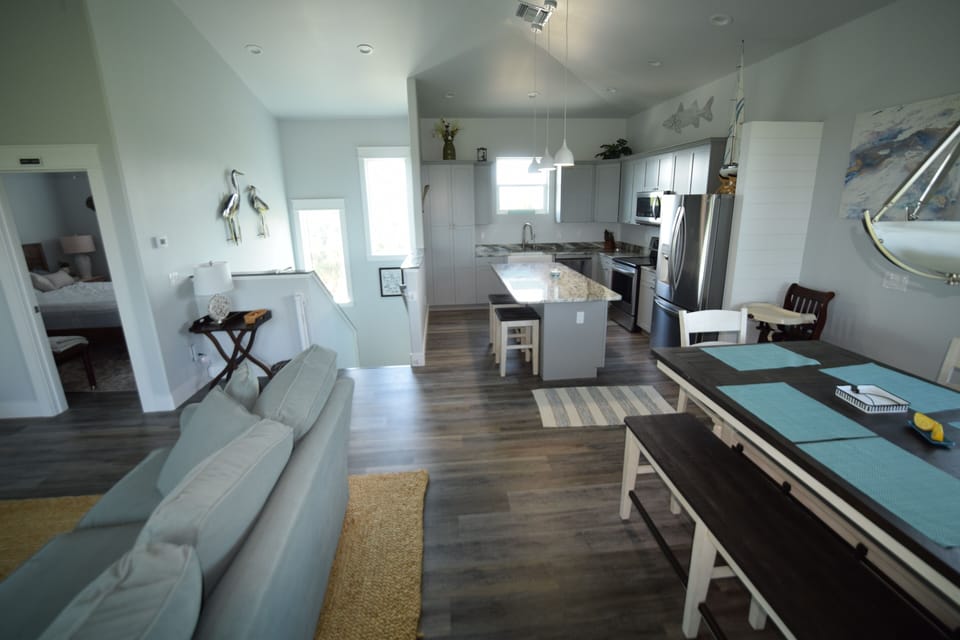 View from dining room to kitchen & stairway; child safety gate on stairs if need