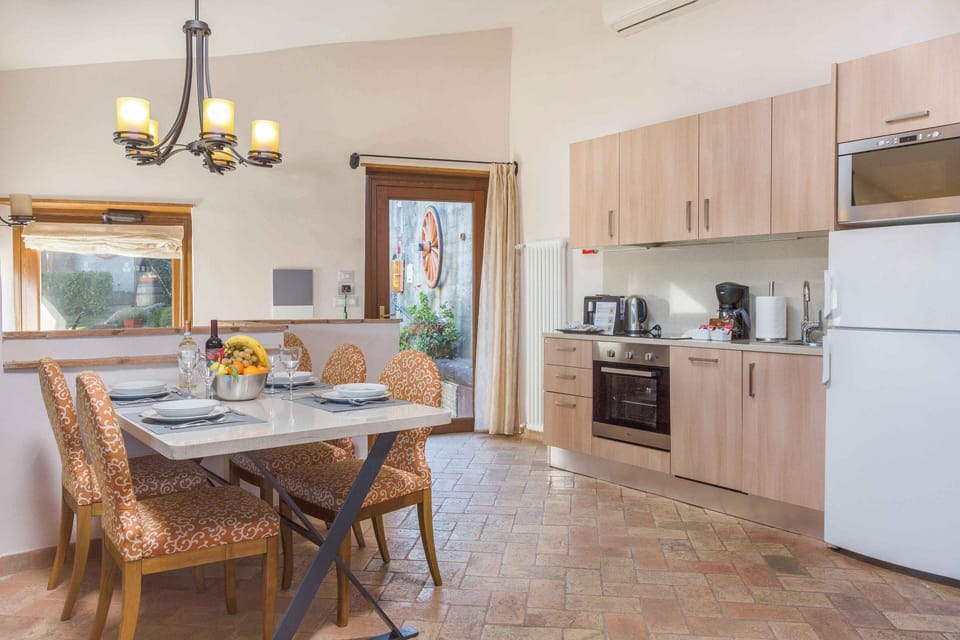 Share homemade meals in a cozy dining space where warm wood tones invite lingering conversation.