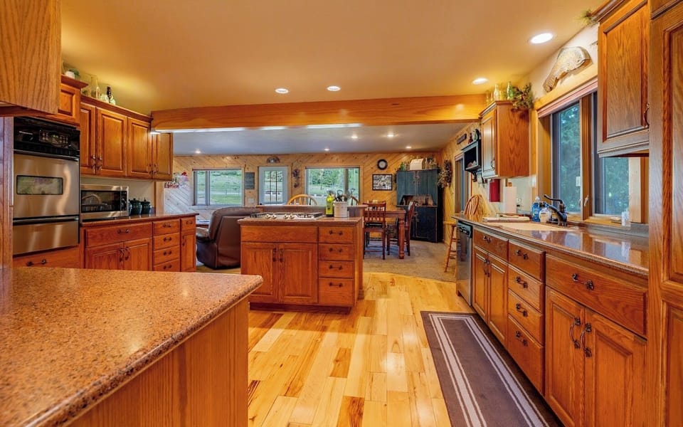 The spacious kitchen layout makes this a hub to gather while preparing meals