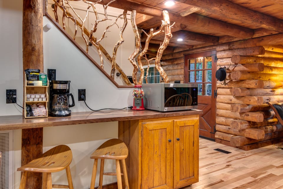 Coffee bar with microwave, coffee maker and CAT 6 outlet.