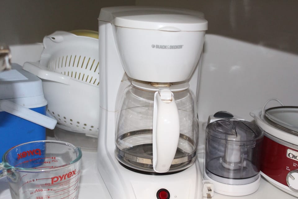 coffee maker, cooler, crock pot, measuring cup, strainers, food processer