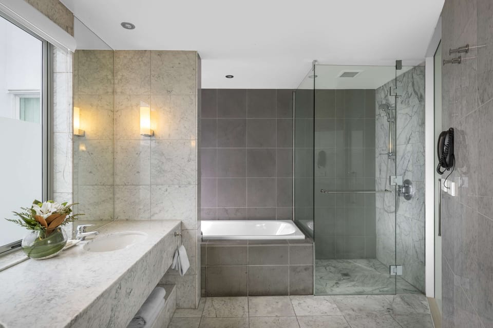 Suite, 1 King Bed (Bow Suite) | Bathroom | Separate tub and shower, free toiletries, hair dryer, bathrobes