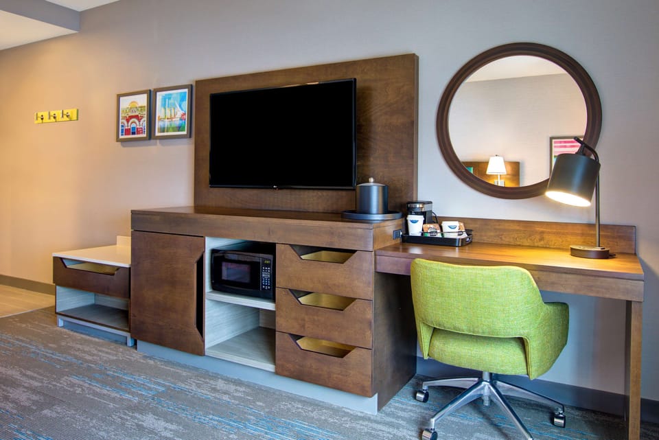 Desk, laptop workspace, blackout drapes, iron/ironing board