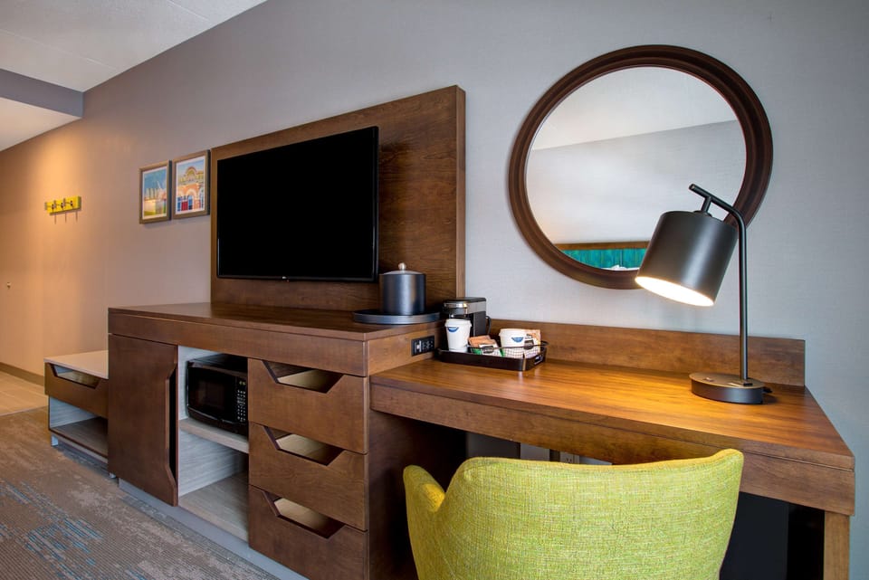 Desk, laptop workspace, blackout drapes, iron/ironing board