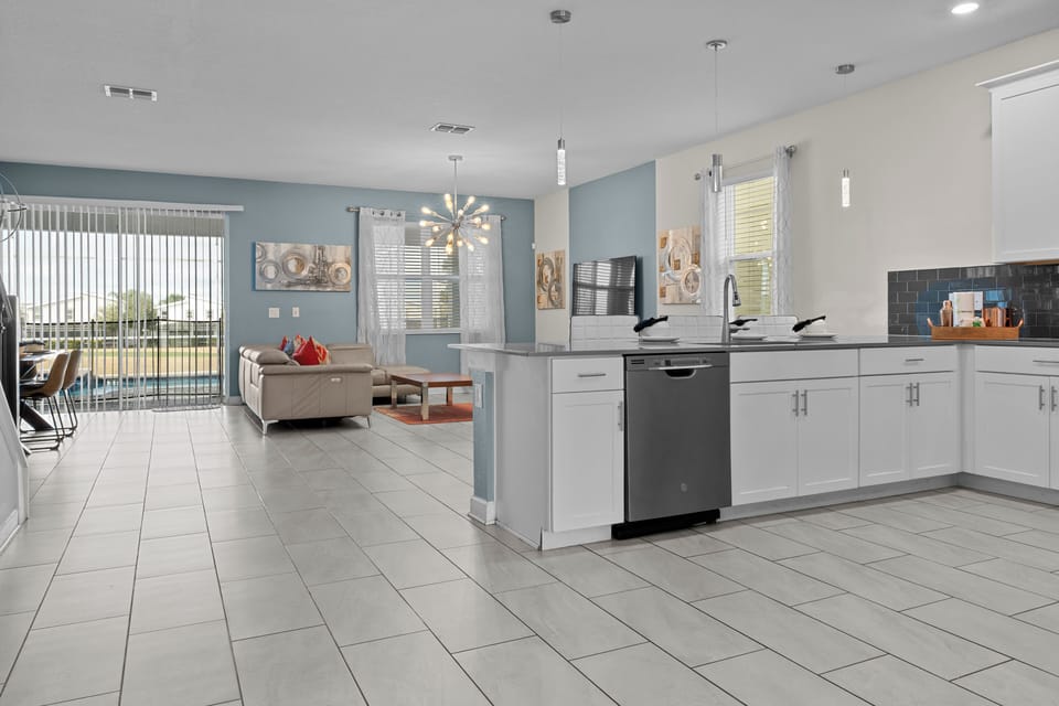You'll love cooking in this modern kitchen with granite counters and stainless appliances, flowing seamlessly into your bright living space.
