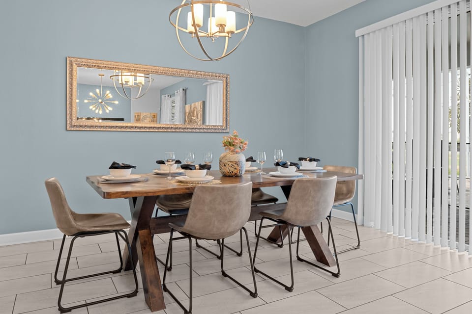 Gather around your elegant dining table for memorable meals, where warm lighting and stylish décor create the perfect atmosphere for celebrating.