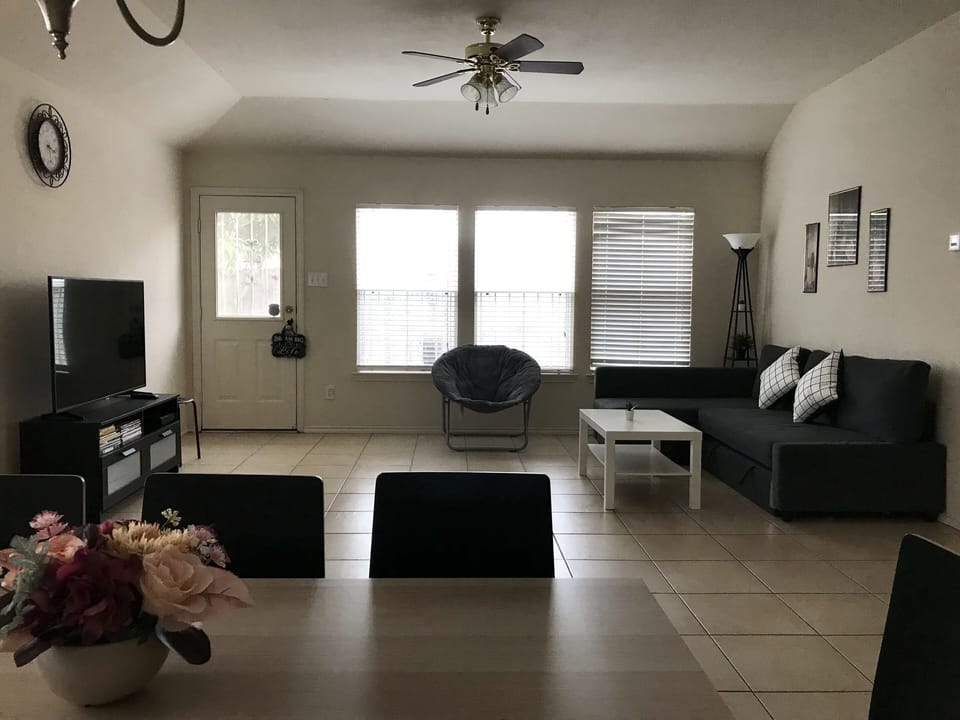 Living room area, smart tv, door leading into back yard