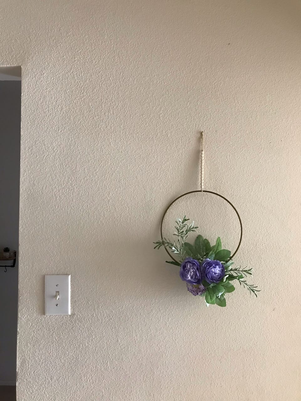 Decor in hallway across from bathroom