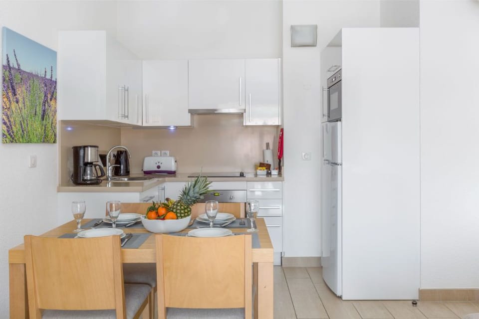 Bright kitchen with a welcoming island, ready for your favorite recipes.