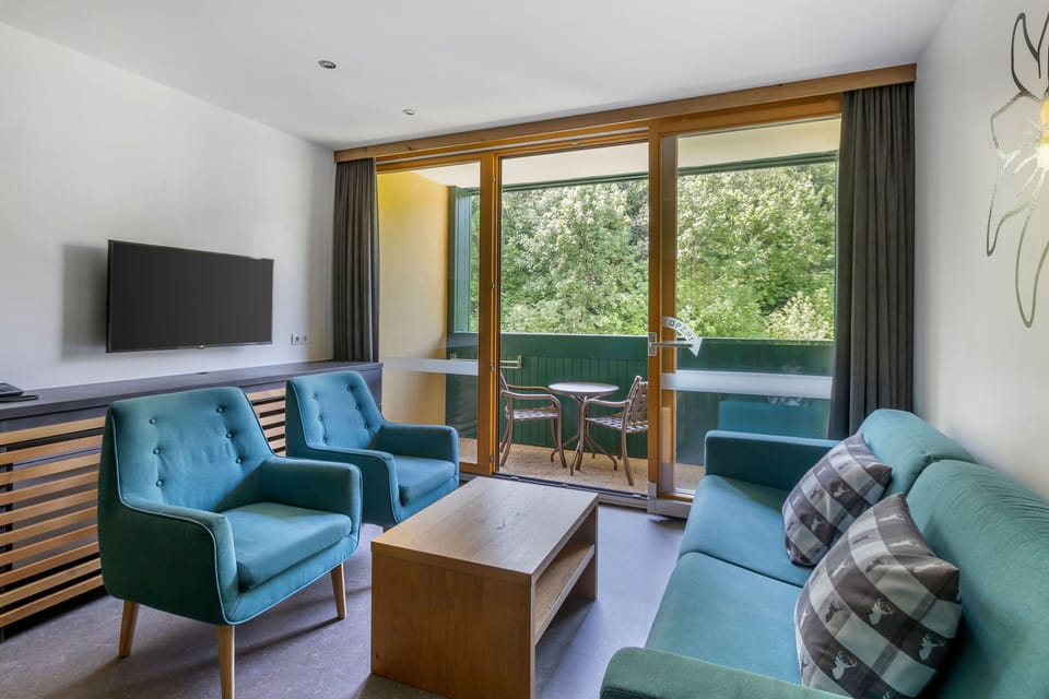 A large living area with vibrant colors and ample seating for relaxation and socializing.