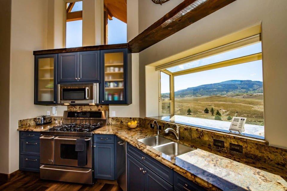 Well-appointed kitchen with amazing high end appliances makes cooking a dream here at 5 Arrows.