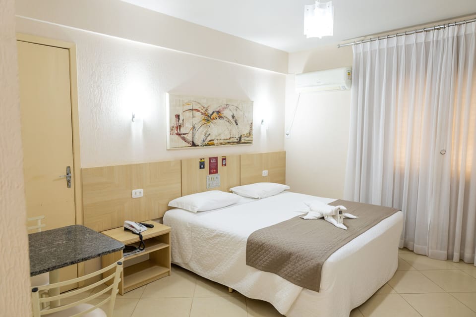 Executive Double Room | Minibar, in-room safe, desk, blackout drapes