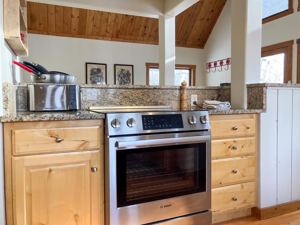 The kitchen is fully stocked with everything you need to prepare and enjoy meals with family or friends.