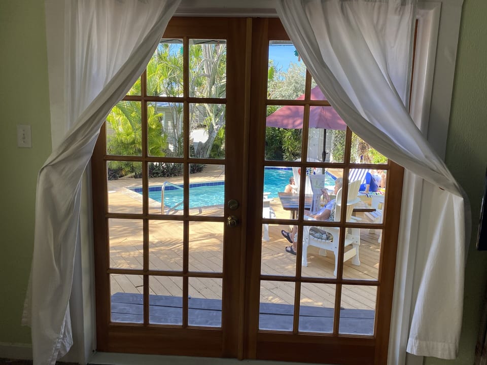 French doors open to pool and hot tub. 