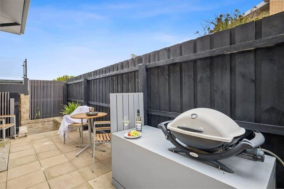 Enjoy meals outdoors in the shared BBQ area