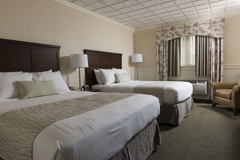 Deluxe Room, 2 Queen Beds (Pool Building) | Desk, blackout drapes, iron/ironing board, cribs/infant beds