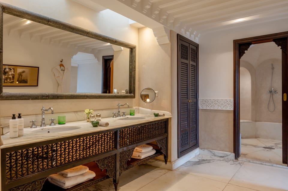 Executive Suite, Balcony, Pool View | Bathroom | Separate tub and shower, free toiletries, hair dryer, bathrobes