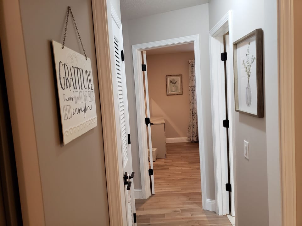 Hallway from dining area to guest bath and bedrooms