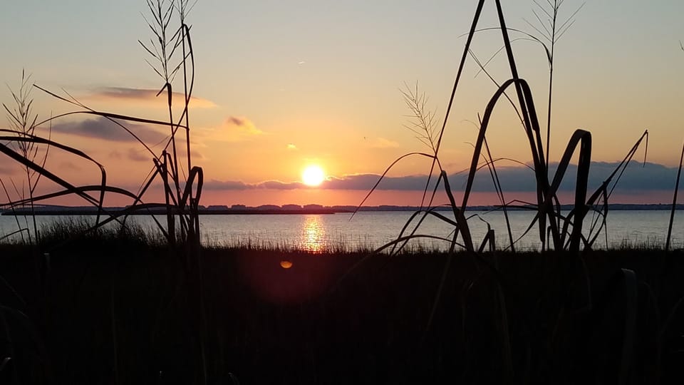 Sunsets over the sound, which is only a couple streets away.