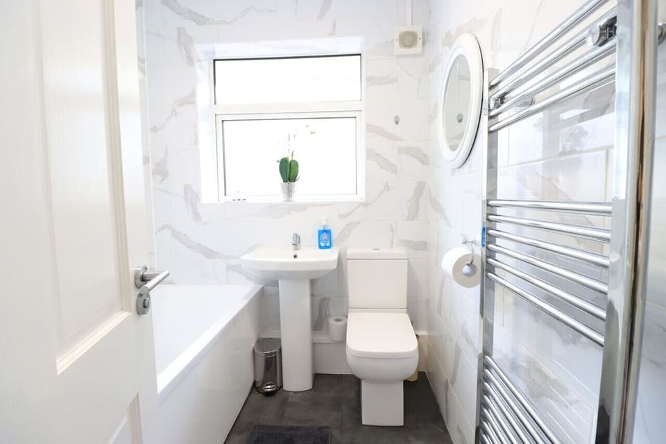 Bathroom with a shower over bath.