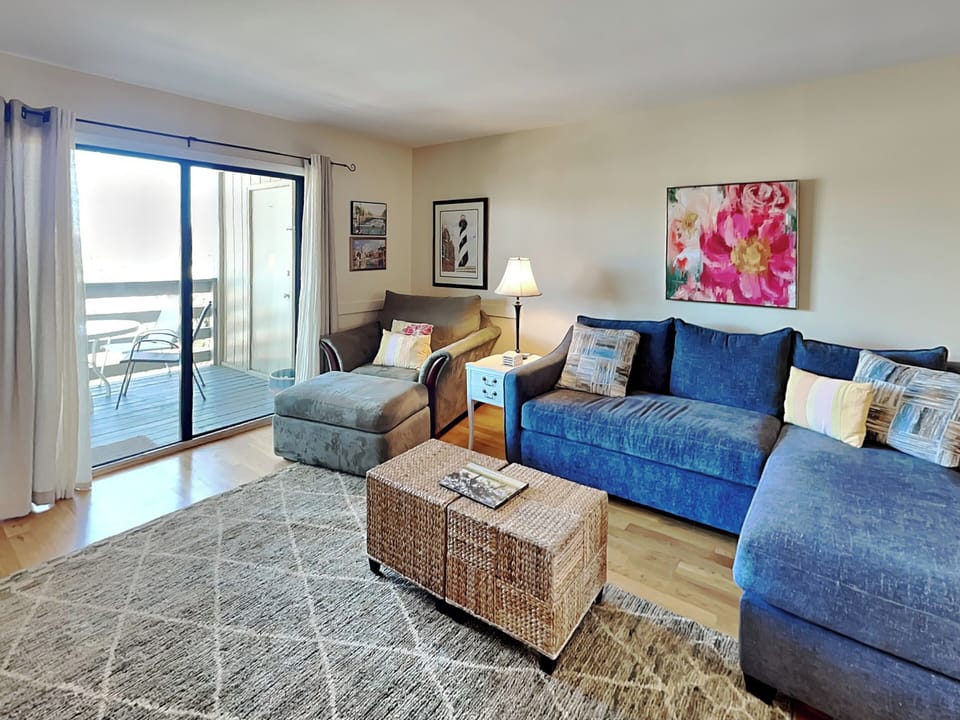Living Area w. Sleeper Sectional, Smart TV, Balcony Access
