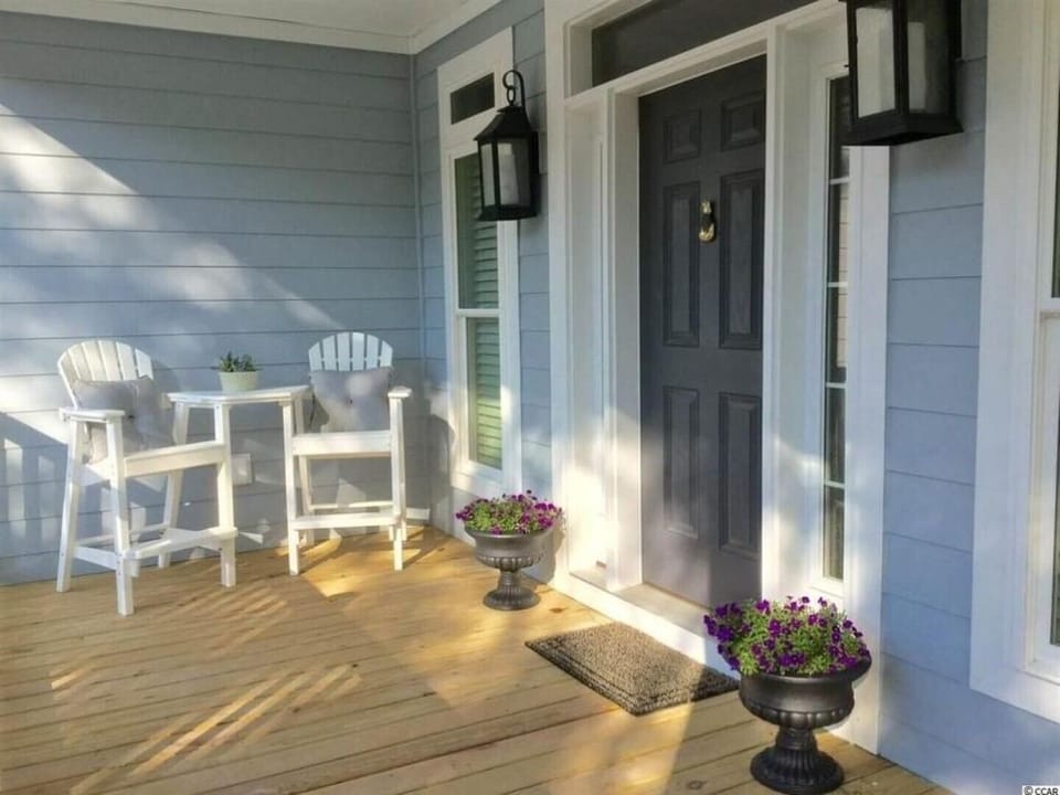 INVITING FRONT PORCH TO ENJOY THE SUNSETS!