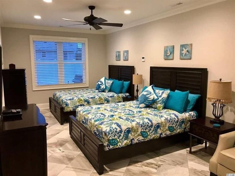 BEDROOM 4 WITH 2 QUEEN BEDS, SITTING AREA, 55" SMART TV, WET BAR & FULL BATH!