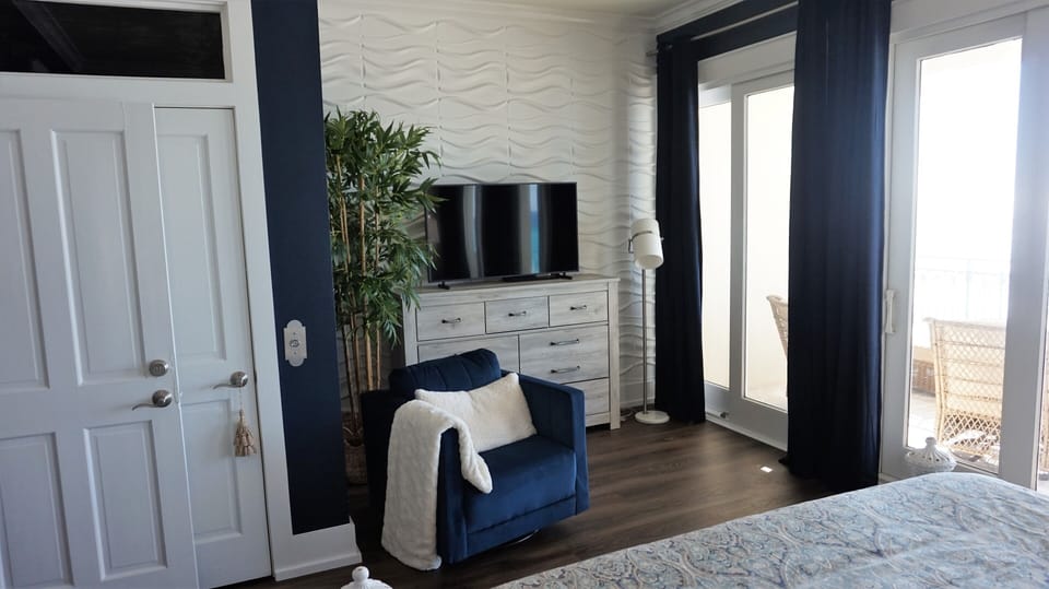 Master bedroom sitting area with TV.