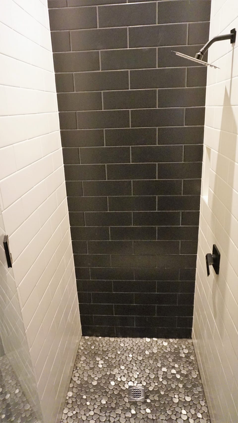Second floor shower with metallic floor.