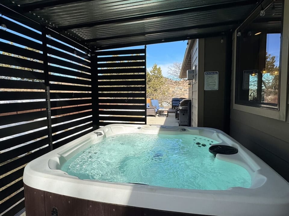 Relax in the hot tub with beautiful views and plenty of seating for outdoor living!