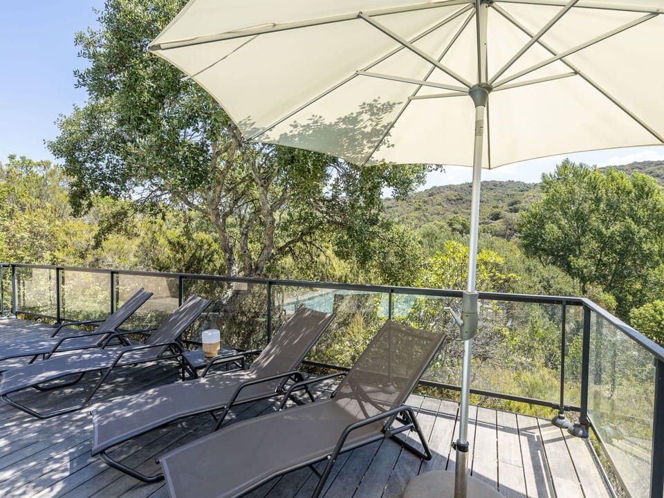 Shade, Outdoor Furniture, Tree, Building, Automotive Exterior, Leisure, Tints And Shades, Chair, Roof, Landscape