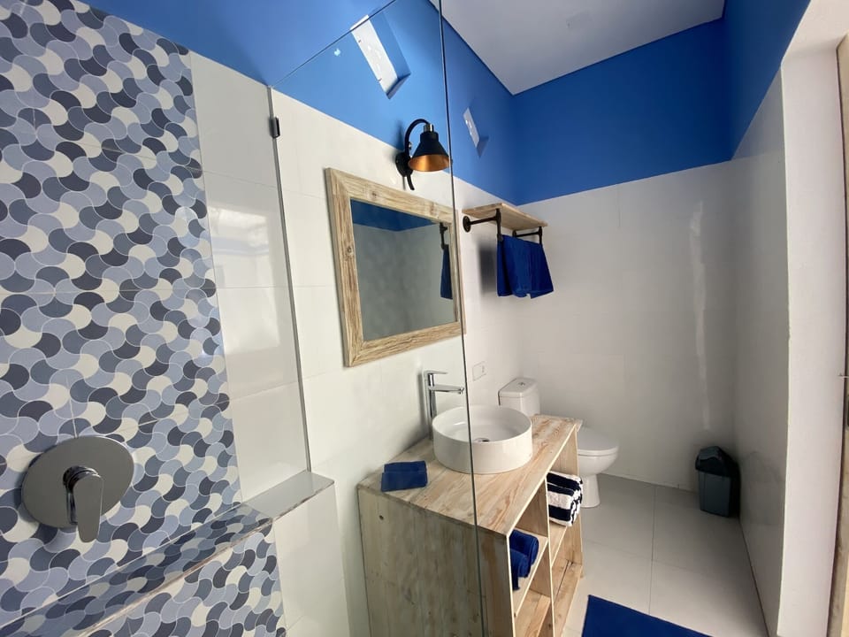 Shower, rainfall showerhead, towels, soap