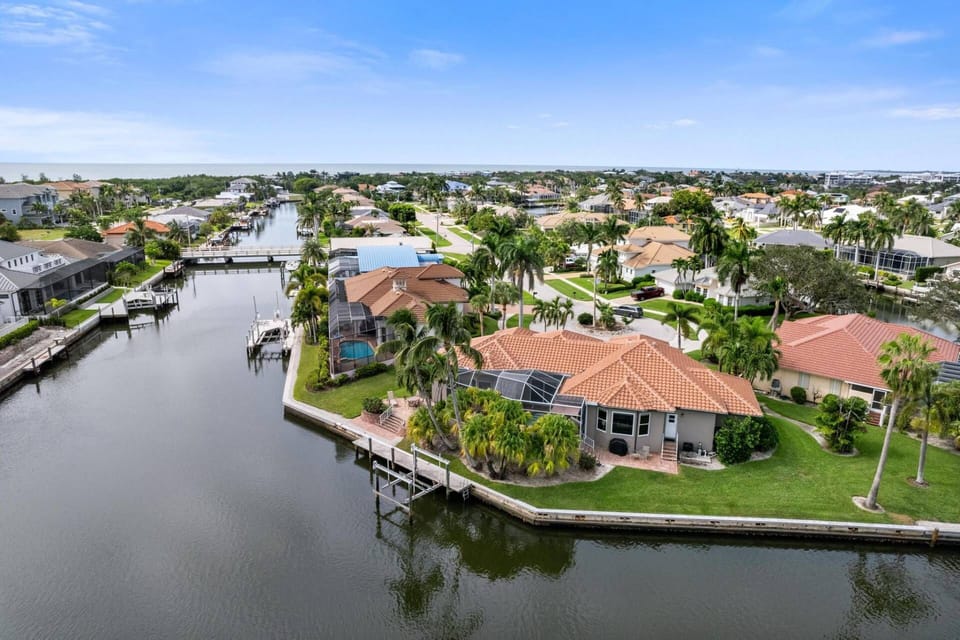 Located on a wide canal, this is a great home to rent kayaks and paddleboards and explore the neighborhood.
